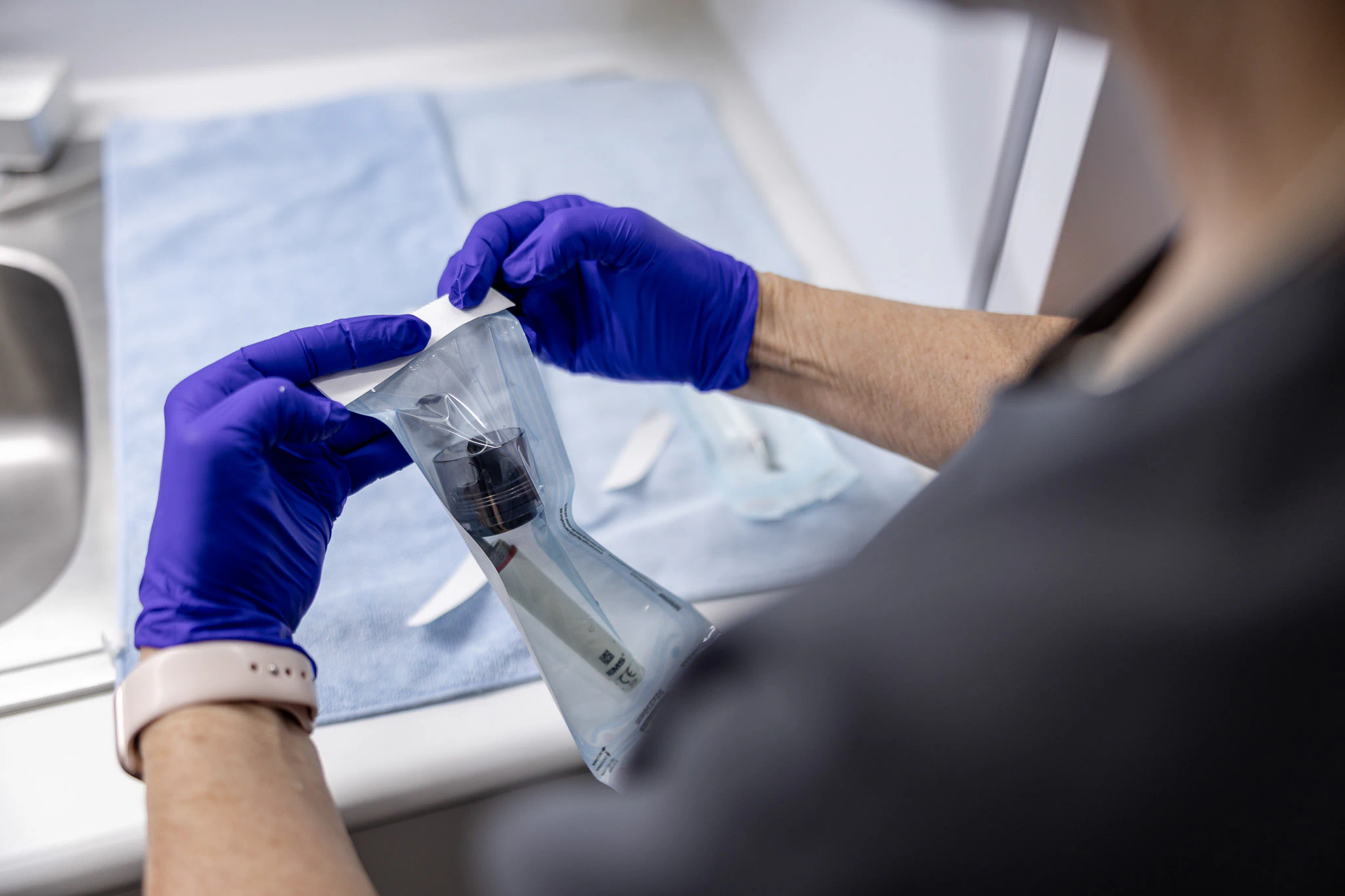 Clinician preparing a dental instrument